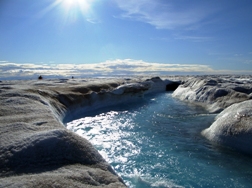 Fig. 7. Large supraglacial stream on the surface of the Greenland Ice Sheet. Photo: Alun Hubbard
